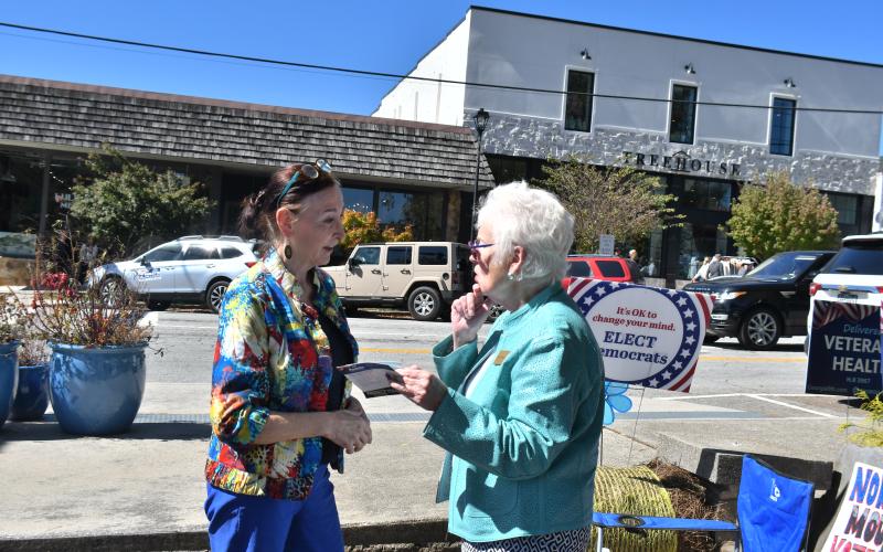 Megan Broome/The Clayton Tribune. Rabun County resident Anne Kirslis speaks with Georgia State Senate Post 50 Candidate Paulette Williams at the Rock House in Clayton Oct. 14 for a meet-and-greet event.