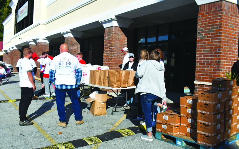 Megan Broome/The Clayton Tribune. The Rabun County Sheriff’s Office, other law enforcement agencies and the faith community came together October 8 at the Food Bank of Northeast Georgia to distribute food, diapers and educational resources to community members during National Faith &amp; Blue Weekend. Law enforcement personnel with Safe Kids Rabun conducted car and booster seat safety checks and car seat technicians were available to check seats for proper fit and installation.