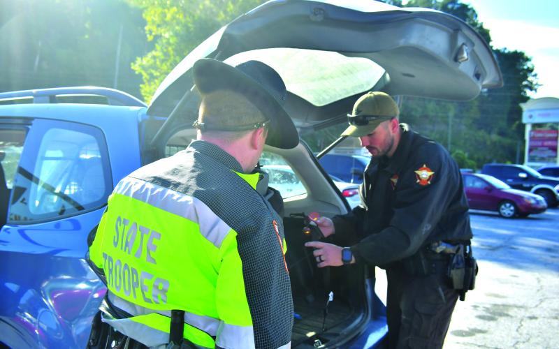 Megan Broome/The Clayton Tribune. The Rabun County Sheriff’s Office, other law enforcement agencies and the faith community came together October 8 at the Food Bank of Northeast Georgia to distribute food, diapers and educational resources to community members during National Faith &amp; Blue Weekend. Law enforcement personnel with Safe Kids Rabun conducted car and booster seat safety checks and car seat technicians were available to check seats for proper fit and installation.