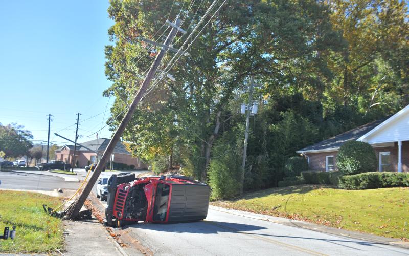 Megan Broome/The Clayton Tribune. A Georgia Power utility power pole was taken out on Hiawassee Street after it was struck by a red 2018 Jeep Wrangler Unlimited Oct. 14. The single vehicle crash resulted in no injuries, but the road was closed for a period of time following the crash.
