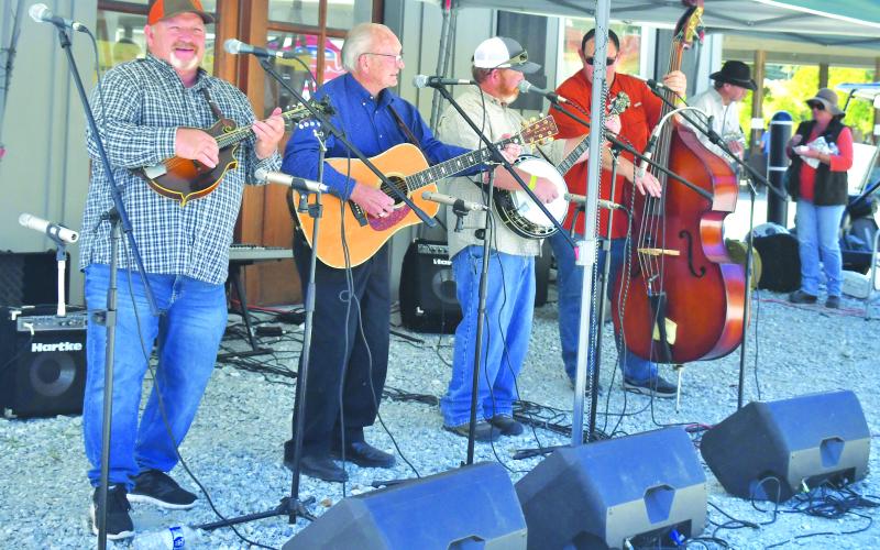 Megan Broome/The Clayton Tribune. Curtis Blackwell and the Dixie Bluegrass Boys perform live music at the Foxfire Mountaineer Festival last Saturday. They were one of many live performances throughout the day.