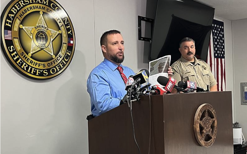 CNI News Service. Habersham County Sheriff’s Office Investigator George Cason shows reporters a picture from the Tallulah Falls school zone camera of Deb Collier’s van traveling toward Clayton on Sept. 10.