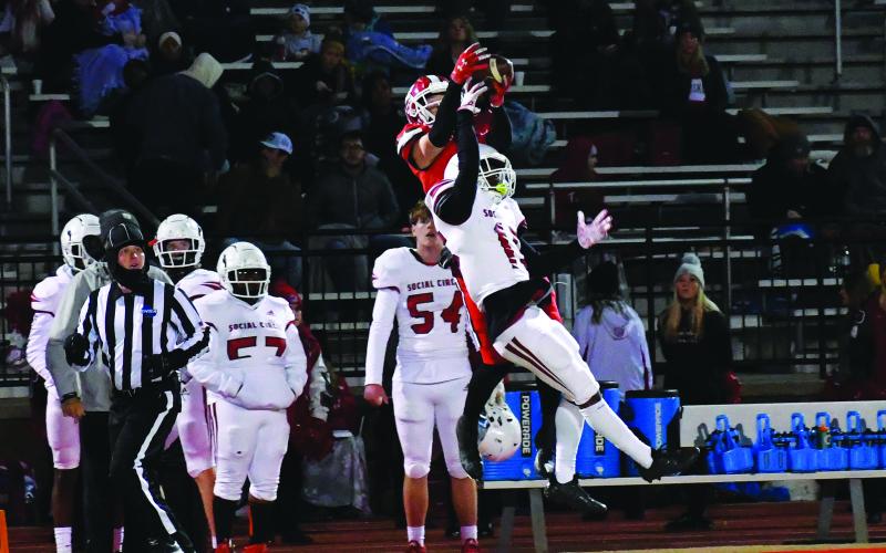 Luke Morey/The Clayton Tribune. Senior recevier Jaden Gibson goes over a defender to haul in a catch he turned into a touchdown. Gibson now has 28 touchdowns on the season, tying a state record set by RCHS alumnus Adriel Clark.