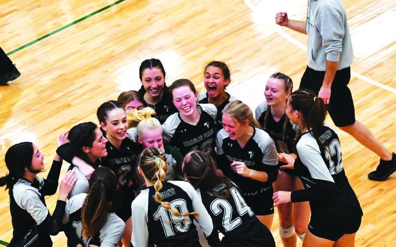 Luke Morey/The Clayton Tribune. Coach Matt Heyl and his team celebrate their first state championship apperarance in school history.