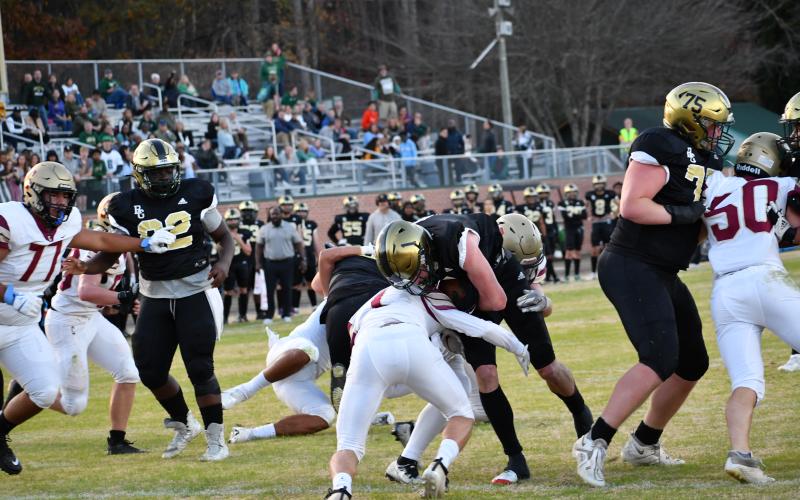 Luke Morey/The Clayton Tribune. Junior Trey Horne fought his way through two Concord defenders for his first touchdown of the night. The Eagles will host Charlotte Christian on Friday, Nov. 11, at 7 p.m.