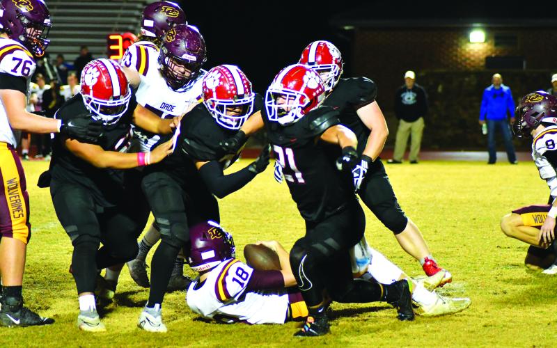 Enoch Autry/The Clayton Tribune. Junior Paul Picciotti (21) reacts after sacking Dade County quarterback Bryson Shroder. The RCHS defense made multiple stops and forced takeaways in the Wildcats’ 47-7 Nov. 11 opening round win.