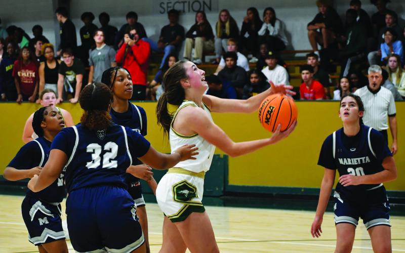 Luke Morey/The Clayton Tribune. Junior Sofia McNabb goes up for a basket in the scrimmage against Marietta on Wednesday night. McNabb had 13 points against North Oconee on Saturday for the Eagles’ first win of the season.