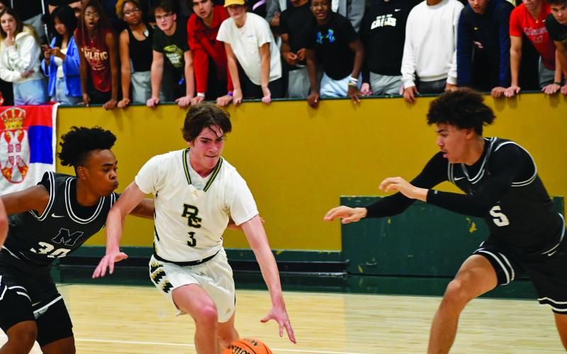 Luke Morey/The Clayton Tribune. Senior Theo Antinori drives in the scrimmage against Marietta last Wednesday night. Antinori finished with 12 points and seven rebounds. The Eagles went 2-0 on Saturday, defeating Lake Pointe Academy and Greenville Classical while limiting them both to under 30 points.