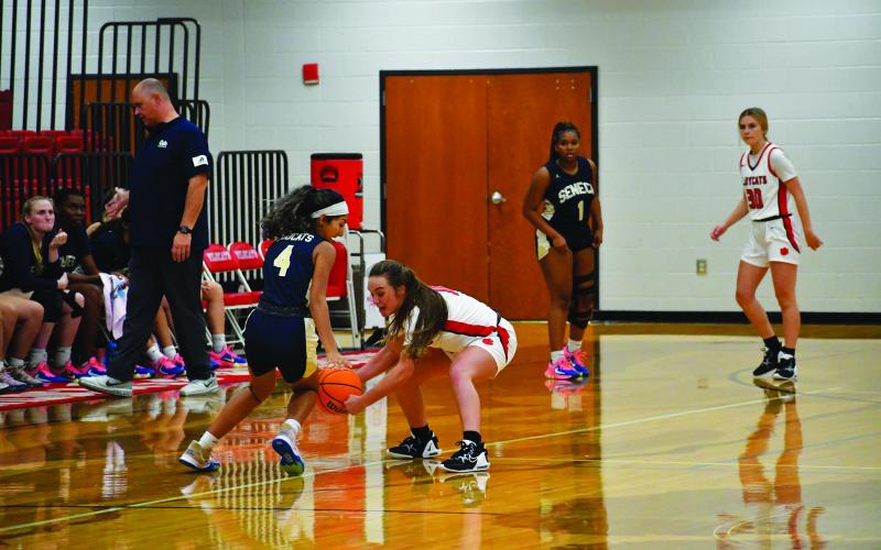 Luke Morey/The Clayton Tribune. Junior Mili Watts steals the ball in the scrimmage against Seneca last Thursday night. Watts had three steals along with 13 points and three assists.