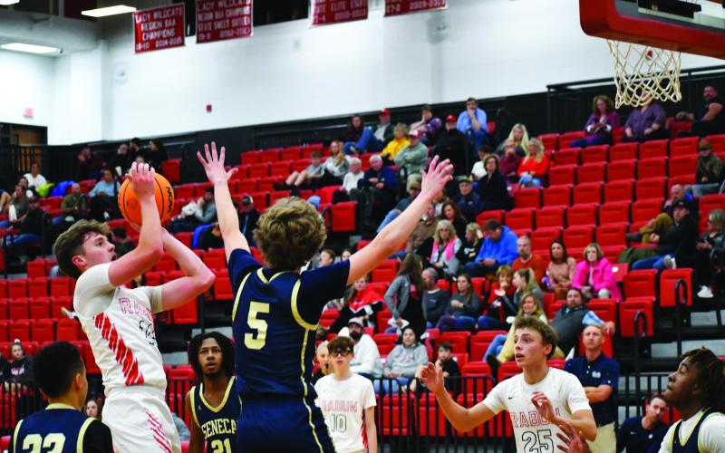 Luke Morey/The Clayton Tribune. Junior Cooper Welch hits a jumper against Seneca on Thursday. Welch will be leading the team as the sole returning starter to the squad.