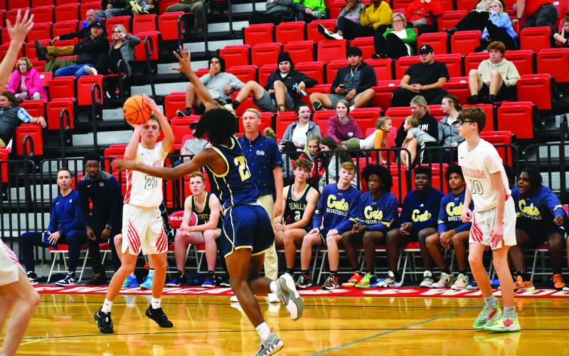 Luke Morey/The Clayton Tribune. Senior Evans Palmer hits a jumper in the scrimmage against Seneca on Thursday. Palmer ended with six points.