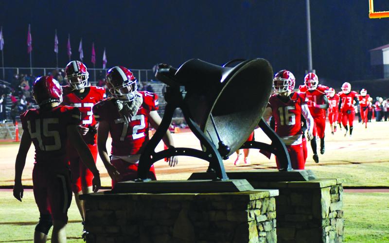 Enoch Autry/The Clayton Tribune. The victorious Wildcats ring the bell on Nov. 18 as they move on to the state quarterfinals.