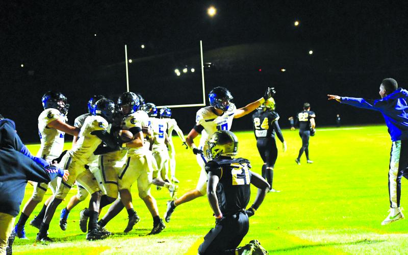 Luke Morey/The Clayton Tribune. Rabun Gap sophomore cornerback Onis Konanbonny falls to his knees after Charlotte Christian converted a last-second Hail Mary to advance to the state championship game.