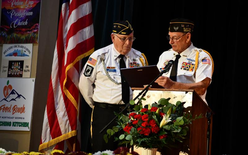Megan Broome/The Clayton Tribune. Veteran Gary Cantwell, right, presents veteran Doug Wayne with a Certificate of Recognition honoring him “for outstanding service to the veterans of Rabun County” at the Veterans Appreciation Dinner.