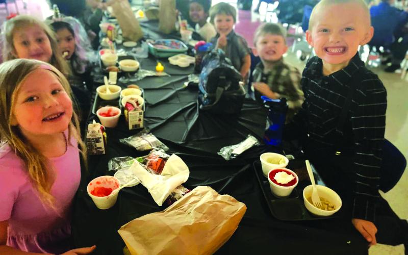 Photography courtesy of Rabun County Primary School. Smiling students from the class of Mrs. Brown, Mrs. Guyer and Mrs. Pate eat lunch.