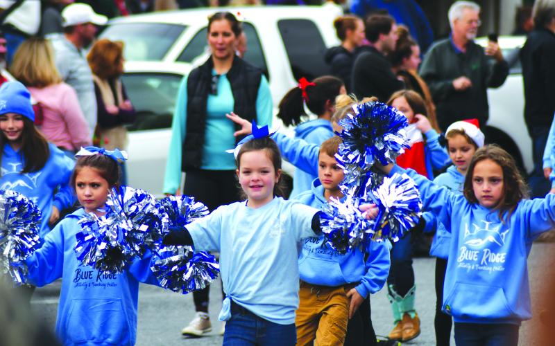 Enoch Autry/The Clayton Tribune. Children from the Blue Ridge Activity &amp; Tumbling Center walk in the Clayton downtown Dec. 3 parade. Shown (from left) are Tori Speed, Juliet Pitassi, Lakin Griffin, Luke Arnett, Lily Rose Tyson and Olivia Briones.