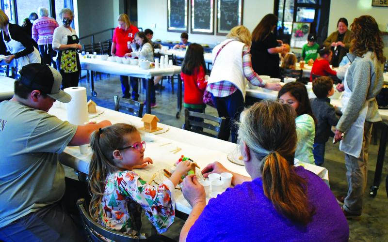 Enoch Autry/The Clayton Tribune. The room at the Teaching Kitchen was busy with creative activity.
