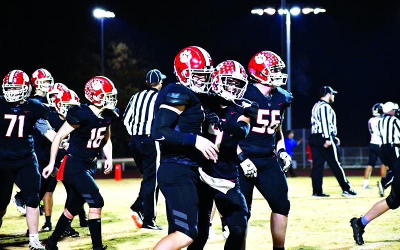 Luke Morey/The Clayton Tribune. Senior Keegan Stover (left) was named “Offensive Player of the Year” for Region 8 while senior Noah Legault (middle) made All-Region first team as a wide receiver. Both seniors transferred to Rabun County this year and made an immediate impact. Sophomore Alex Yearwood (56) also made the All-Region second team.