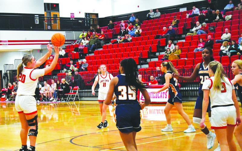 Luke Morey/The Clayton Tribune. Junior Ellie Southards hits a shot in the first quarter of the game against Lakeview as junior Lucy Hood (11)  looks on. Southards had 22 points on Wednesday, Dec. 21 to help the Lady Cats win 91-39.