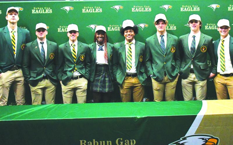 Luke Morey/The Clayton Tribune. On Wednesday, Dec. 7, eight Rabun Gap-Nacoochee School seniors signed their Letters of Intent to play at the collegiate level. From left, Domas Kauzonas (University of North Carolina Greensboro); Brody Roulier (Missouri S&amp;T); Lewis Rodriguez (Marist); Calea Jackson (University of Miami): Armani Guzman (West Virginia); Nickolas Roy (University of Buffalo); Dylan Alonso (Middle Tennesee State) and Luke Earnhardt (Middle Tennessee State).