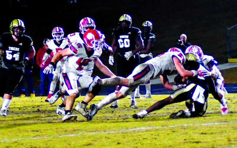 Luke Morey/The Clayton Tribune. Rabun County senior Ethan Owens (45) looks on as junior Paul Picciotti and senior Nic Baloga combine to bring down Swainsboro’s Damello Jones. Baloga ended the season with 196 total tackles, good for 12th in the nation. Owens ended with 113 total tackles in the regular season, good for top 10 in the state. Picciotti led the team with six sacks as well as 54 tackles and 10 for a loss.