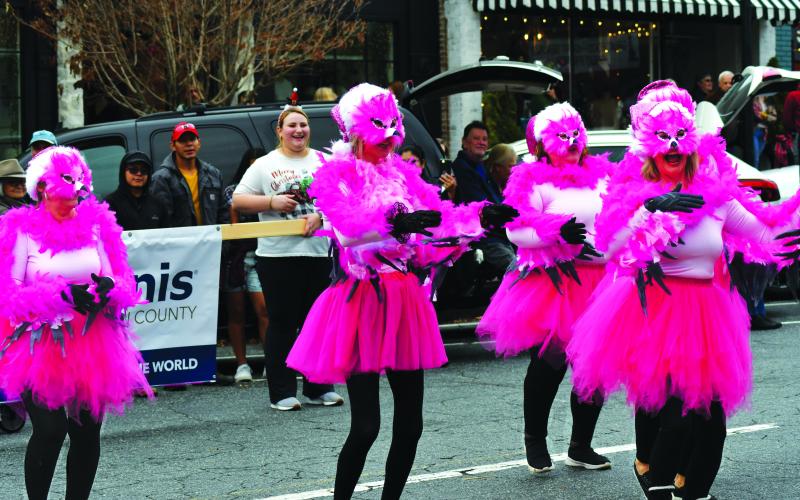 Enoch Autry/The Clayton Tribune. The “Most Original Costumes and Decorations” category winner in the Dec. 3 downtown Clayton Christmas Parade was five female club members dressed as feathery pink dancing flamingos from the Kiwanis Club of Rabun County.