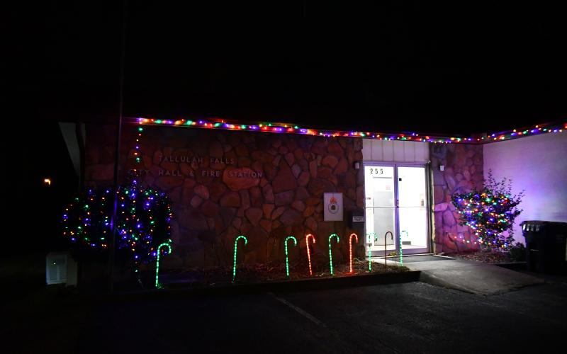 Megan Broome/The Clayton Tribune. Tallulah Falls Town Hall is decorated in Christmas lights as the town kicked off the Christmas Season with a Christmas Party and lighting of the floating Christmas Tree event Dec. 2.