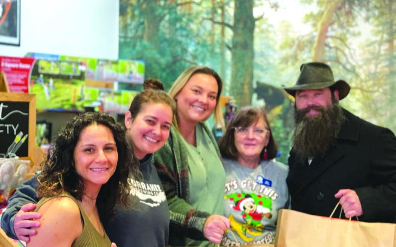 Submitted photo. Currahee Brewing Company in Clayton raised $800 for the local Duvall Automotive Toys for Our Town charity at its nonprofit fundraising night Dec. 1. The event also brought in two truck loads of toys to be shared in Rabun County. Donations to Toys for Our Town are distributed to children in need exclusively in Rabun County. Pictured are community members and business owners Sandra Glichowski, left, Hillary Marshall, Ara Joyce, Patti Barnett, and Scott Mazarky shopping for children.