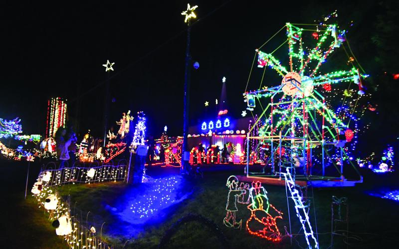 Megan Broome/The Clayton Tribune. This ferris wheel with teddy bears is one of the many displays featured at the Christmas Village of Lights located in Tiger.