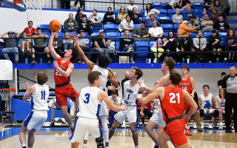 Luke Morey/The Clayton Tribune. Senior Jayton Henry goes up for a layup against Towns County in the semifinals on Thursday, Dec. 29. Henry posted 22 points to help the Wildcats to the championship game where they won 54-53. Henry was named to the All-Tournament team.