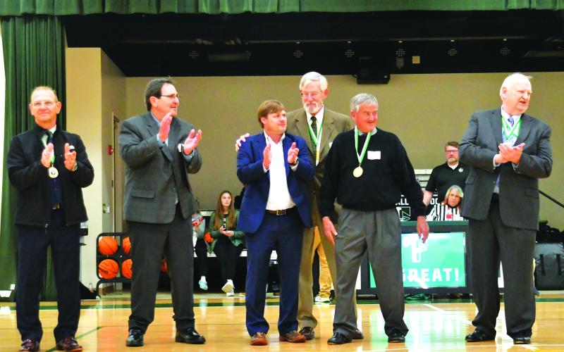 Enoch Autry/The Clayton Tribune.  The 2022 Hall of Honor inductees were honored on Saturday night. From left, Chuck Nunn, the 1968 football team who had four representatives show up, and Tim Crenshaw.