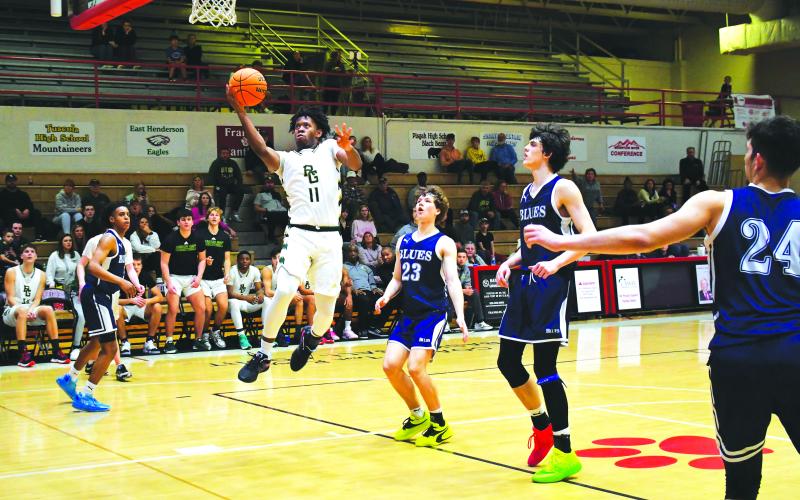 Luke Morey/The Clayton Tribune. Junior Zayne Vernon takes a free path to the basket for an easy two points in the second half against Asheville. Vernon had 10 points in one of his first games back from an ankle injury.