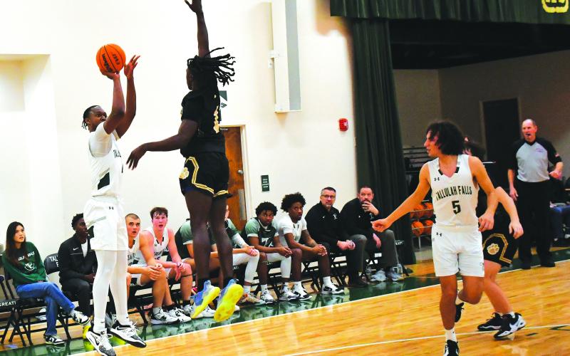 Luke Morey/The Clayton Tribune. TFS senior Anfernee Hanna hits a three against Commerce on Friday, Jan. 13. Hanna had 17 points as TFS split their games over the weekend, falling to Prince Avenue Christian on Saturday.