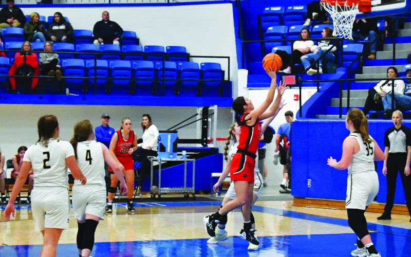 Luke Morey/The Clayton Tribune. Senior Mary Lovell spins to hit a basket on Wednesday, Dec. 28 against Hayesville. Lovell was named to the All-Tournament team.