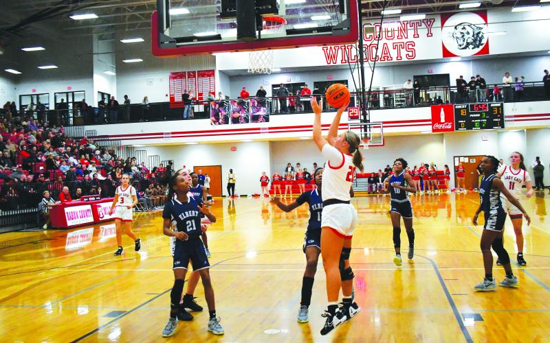 Luke Morey/The Clayton Tribune. In front of a packed gym on Friday, Jan. 20, RCHS junior Ellie Southards lays in a basket in the third quarter against last year’s state champ Elbert County. In the first rematch between Elbert and RCHS since last year’s GHSA AA state title game, the Lady Cats won 55-49.