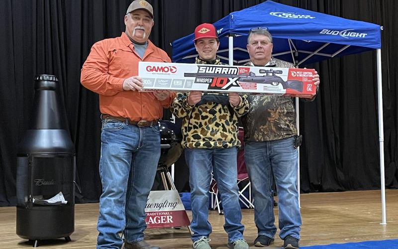 Tony Penrose/The Clayton Tribune. The One for the Wall 2022-2023 Deer Contest included many participants at the Rabun County Civic Center Saturday, Jan. 28. Pictured are Organizer Lee Callenback, left; with Layne Holcomb, Youth Gun Raffle Winner; and Organizer Shayne Beck.