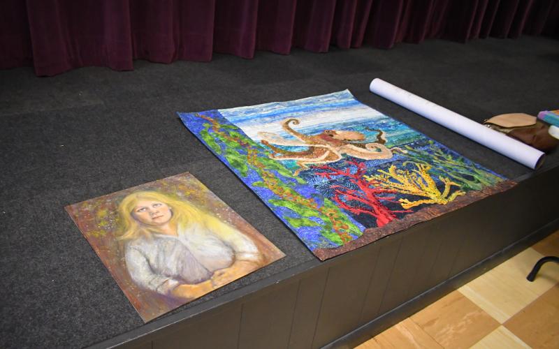 Megan Broome/The Clayton Tribune. Over 20 members of the North Georgia Arts Guild displayed their works at the annual Members Show and Tell themed “Winter Blues” during the organization’s meeting Feb, 16. Artists gave presentations for each of their works, describing the medium and inspiration behind them, then displayed them for other Guild members to observe and converse about during the meeting.