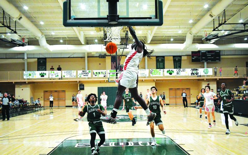 Luke Morey/The Clayton Tribune. RCHS junior Willie Goodwyn slams home a tomahawk dunk agianst Tallulah Falls on Thursday, Feb. 16.  Goodwyn ended with 19 points as he helped the Wildcats to the region championship game.