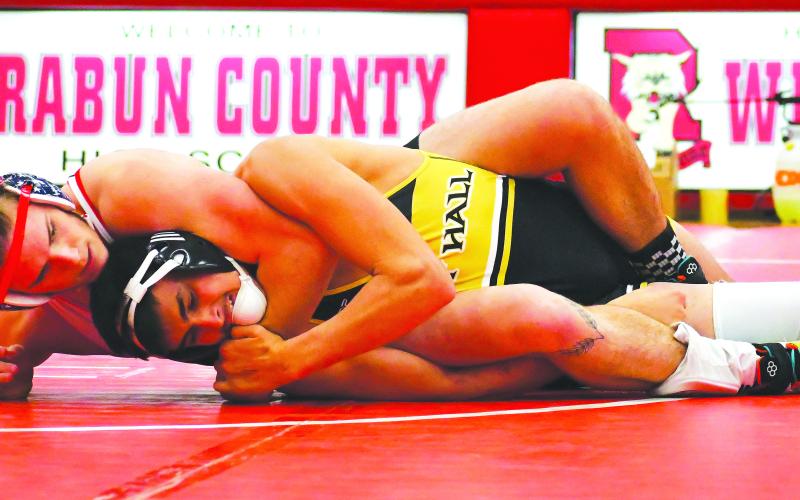Luke Morey/The Clayton Tribune. Rabun County senior Miles Watts grapples with an East Hall opponent on Tuesday, Jan. 24. Watts looks to compete again in the GHSA state championship after taking state runner-up last year.