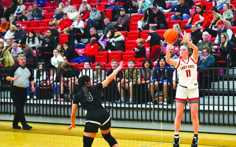 Luke Morey/The Clayton Tribune. RCHS junior Lucy Hood hits a three over TFS defender junior Allie Phasavang. Hood scored 19 points in the final regular season game. The Lady Cats take on Tallulah Falls again in the first round of the region tournament. The region tourney will be held at Piedmont University, with the Lady Cats as the No. 2 seed behind Elbert County. The championship game will take place on Friday, Feb. 17, at 8 p.m.
