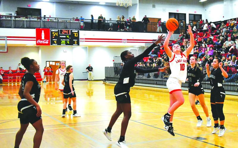 Luke Morey/The Clayton Tribune. RCHS junior Mili Watts goes up for a layup against Tallulah Falls on Friday, Feb. 10. Watts ended with 14 points, including 10 in the first quarter, to help the Lady Cats to a  72-62 victory. Watts also added three steals and four rebounds as the primary defender on Tallulah Falls’ best player Denika Lightbourne.