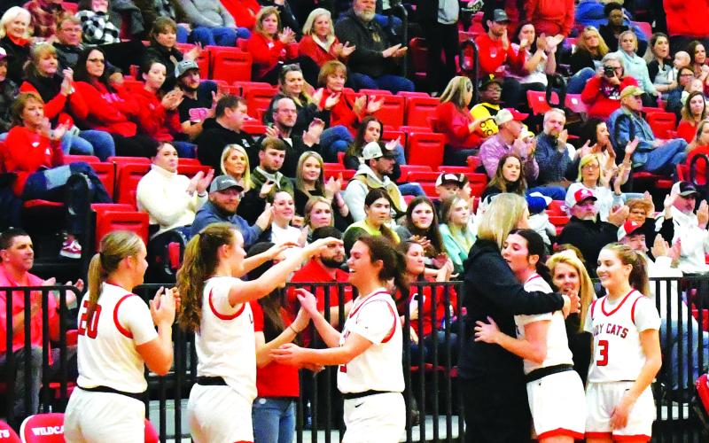 Luke Morey/The Clayton Tribune. The three Lady Cat seniors receive an ovation as they check out of their second to last home game of the regular season. From left, the seniors include Bailey Maloney, Mary Lovell and Trea Blalock.