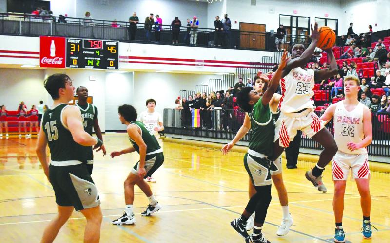 Luke Morey/The Clayton Tribune. RCHS junior Willie Goodwyn goes up for a shot in the fourth quarter against Tallulah Falls on Friday, Feb. 10. Goodwyn had his best game of the season, ending with 25 points and 20 rebounds in a 71-41 victory. The Wildcats are the No. 2 seed in the region tournament, taking on Tallulah Falls again on Thursday, Feb. 16.