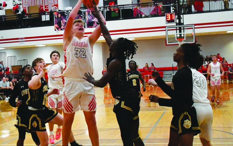 Luke Morey/The Clayton Tribune. Junior Jack Hood goes up for a put back during the second game against Commerce on Friday, Jan. 27. Hood ended with 16 points.