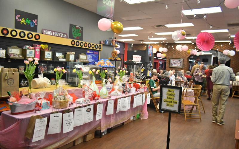 Megan Broome/The Clayton Tribune. A raffle with prizes was one of the many activities that raised money for the cause.