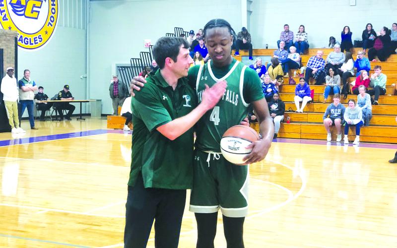 TFS Athletics. TFS senior Anfernee Hanna receives a game ball from TFS coach Cody Coleman after a game against Athens Christian on Friday, Jan. 20. During the game, Hanna surpassed 1,000 career points for his career. In the games following, Hanna became the all-time leader in wins with 62 and counting. Hanna and the TFS basketball team have three more games untl the region tournament begins on Monday, Feb. 13.