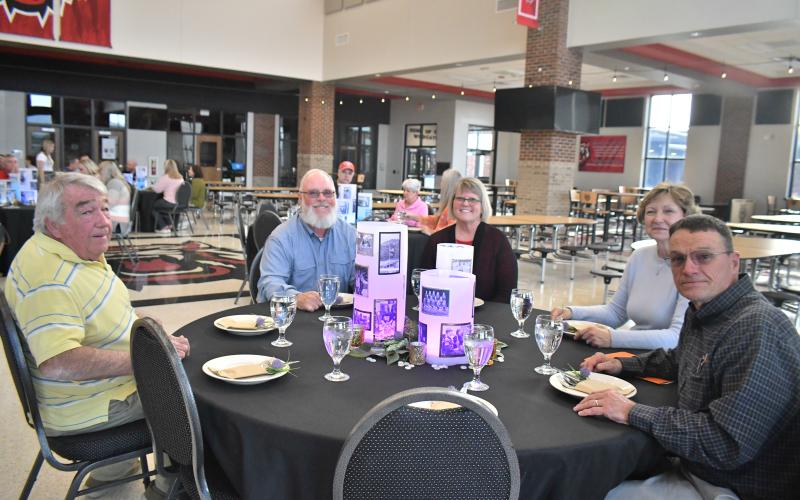 Megan Broome/The Clayton Tribune. Rabun County Board of Education members were honored with a four-course dinner catered by Rabun County dual enrollment culinary students at the Rabun County High School cafeteria Thursday, March 16, for “School Board Appreciation Week.” Board members celebrated the honor with family. Pictured are board member Wayne Stephens (left); board member Mark Beck with spouse Laverne Beck; and Annette Cabe with spouse and board member Steven Cabe.