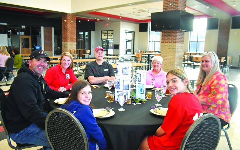 Megan Broome/The Clayton Tribune. Pictured clockwise are Tony Lima with spouse and board member Molly Lima; board member Curt Haban; Kitty Panell, secretary for superintendent; Dr. April Childers, Rabun County Schools superintendent; Ella Lima; and Bristol Lima.