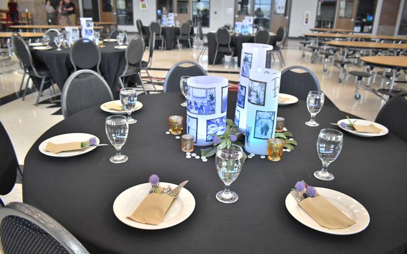 Megan Broome/The Clayton Tribune. Tables in the cafeteria at Rabun County High School had decorative place mats and displays featuring Rabun County students during a four-course dinner honoring Rabun County Board of Education members during “School Board Appreciation Week” Thursday, March 16. The meal was catered by Rabun County culinary students.