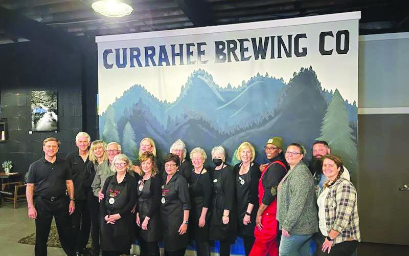 Submitted photo. Volunteers at the Currahee Brewing Company nonprofit night March 2 show support to the Food Bank of Northeast Georgia Food 2 Kids Program as the community came out and raised $2,900.